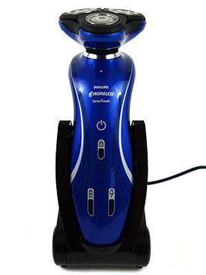 Philips Norelco 6100 electric shaver sitting in charging stand front photo