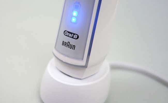 Oral-B White 7000 Electric toothbrush on charging stand