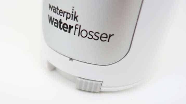 Waterpik Cordless Freedom water flosser battery cover release lever